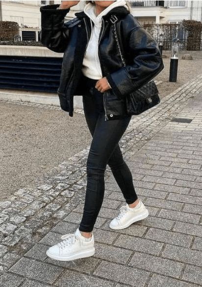 A Hoodie Layered With a Leather Jacket