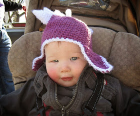 baby in dino hat