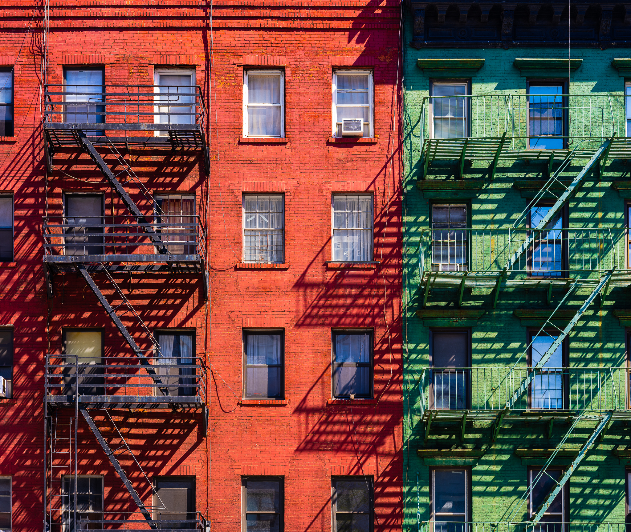 a photo of classic new york architecture with fire escapes