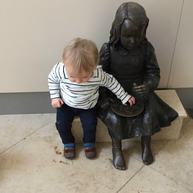 Squidge playing with a bronze little girl