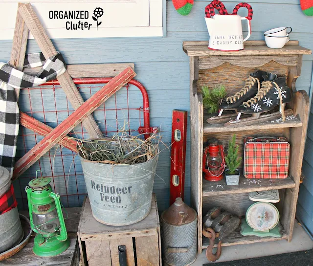 2019 Rustic Christmas Covered Patio Junk Decor #RusticChristmas #oldsignstencils #farmjunk #farmtools #farmsequipment #plaid #buffalocheck #outdoordecor