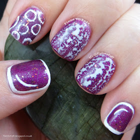 Purple and white bubble nail art manicure.