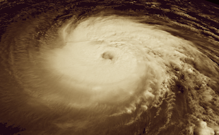 Screengrab of NOAA satellite image of hurricane, with sepia tone added