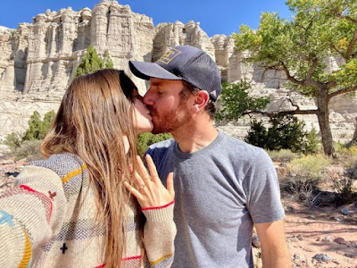 Lily Collins announced her engagement to film director and writer Charlie McDowell. The filmmaker kneeling and a close-up of the impressive ring.