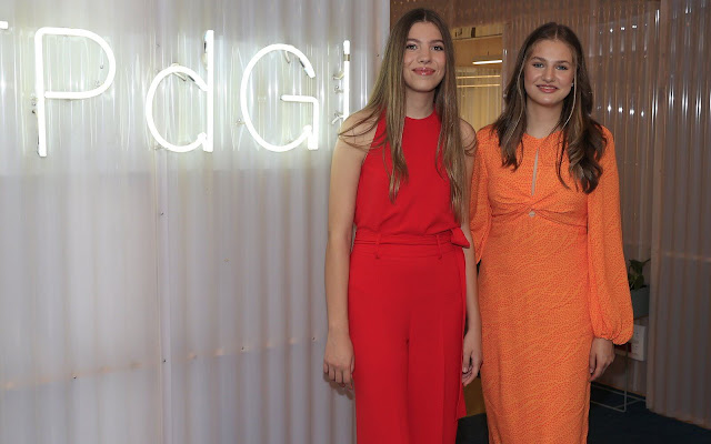 Crown Princess Leonor wore an orange dress by Lady Pipa. Infanta Sofia wore a red blouse and pants, jumpsuit, by Sfera
