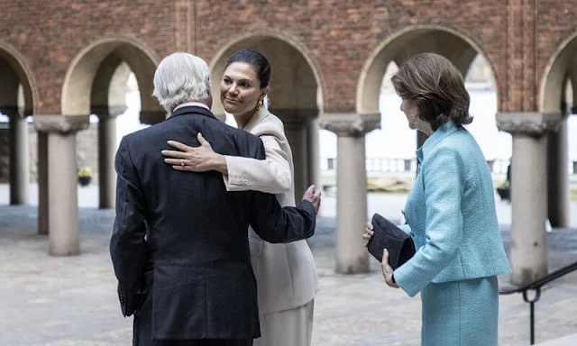 Andiata silk top. Crown Princess Victoria wore a cream blazer, jacket and cream trousers by Andiata. Queen Silvia wore a light blue jacket