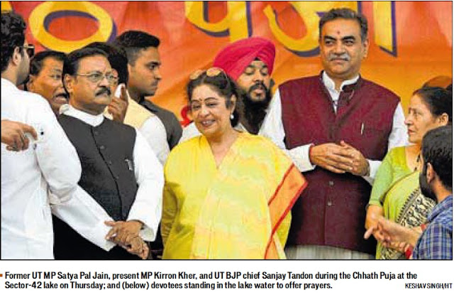 Former UT MP Satya Pal Jain and present MP Kirron Kher during the Chhath Puja at the Sector 42 lake on Thursday