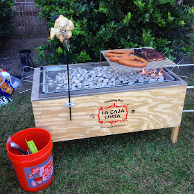 Whole Hog inside of a roasting box, rotisserie chicken, and more delicious eats.