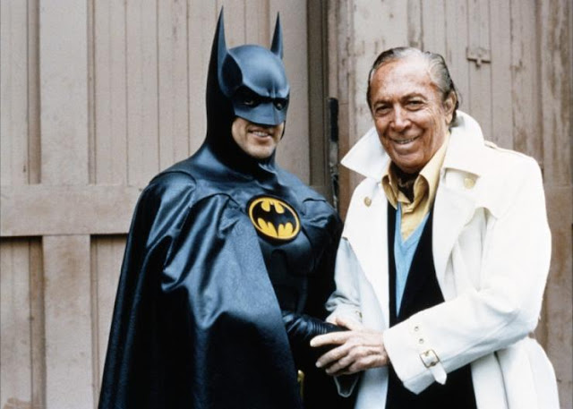 Bob Kane posing with the Caped Crusader, Kane's iconic creation, Batman