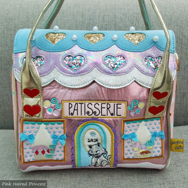 pastel metallic handbag in shape of cafe with cat embroidered details