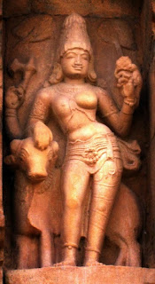 Ardhanarisvara, or Shiva and his shakti or female nature combined in one image. He-she is seen riding the bull Nandi. The seductive one-breasted torso is surmounted by the high-domed head which represents the lingam. The essential nature of Shiva is seen in the reconciliation of opposites. From the Elephanta caves. 