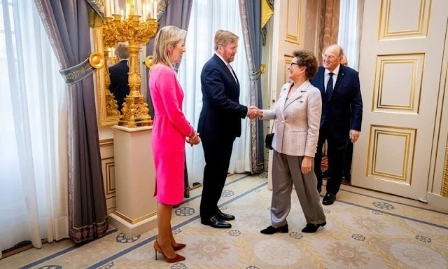 Queen Maxima wore a pink midi dress by Natan Couture, red flower earrings. The Order of the House of Orange