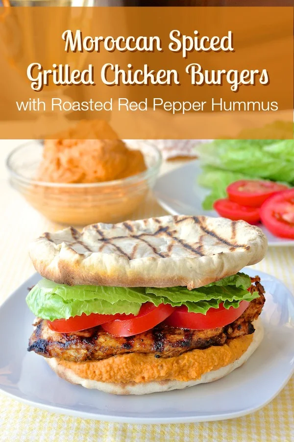 Moroccan Marinated Grilled Chicken Flatbread Burgers with Red Pepper Hummus - a simple, spiced marinade flavors the chicken while the flatbreads are made on the grill right alongside it. Creamy red pepper hummus completes this delicious combination of flavors and textures.