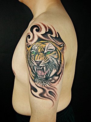 forearm tribal tattoo. lion tattoo on forearm.