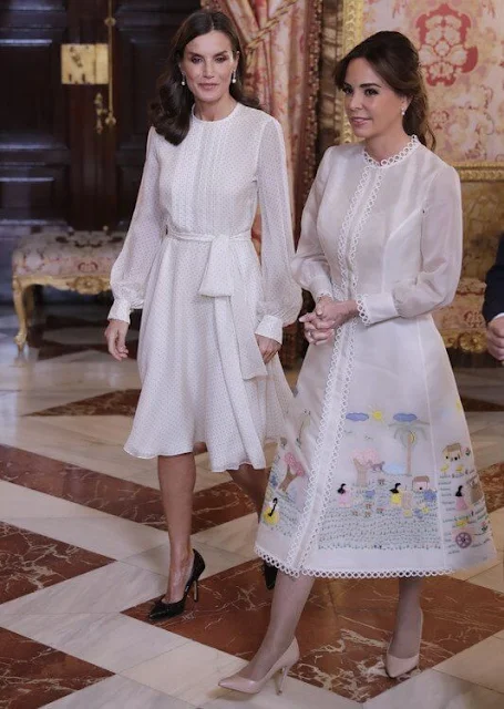 Queen Letizia wore a dots-style chiffon silk midi dress by Carolina Herrera. Infanta Sofia. First Lady Silvana Lopez Moreira