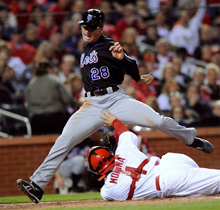 Yadier Molina tries to grab Daniel Murphy's package