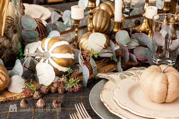 gold pumpkins, acorns, greenery, candles