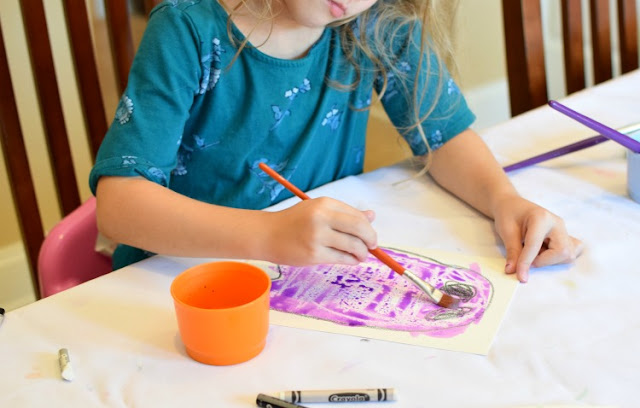 Halloween Rainbow Ghost Garland Craft with Watercolor Resist.  Fun art project for toddlers, preschoolers, or elementary kids for Halloween- bright and cheerful, not spooky!