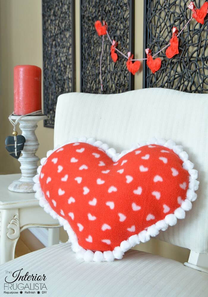 If you can sew a straight line then you can make this adorable fleece heart pillow for Valentine's Day in less than 15 minutes. Sewing machine optional!