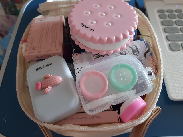 A necessaire with contact lenses and cases