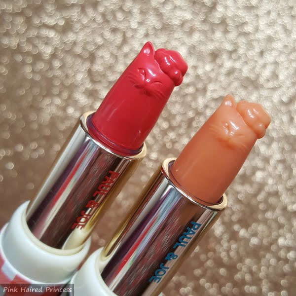 close up of Paul & Joe limited edition lipsticks in cat shape with Santa hats