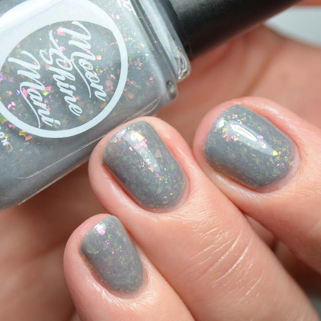 grey nail polish with flakies swatch