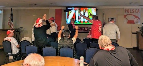 The room goes wild after Poland scores a second goal