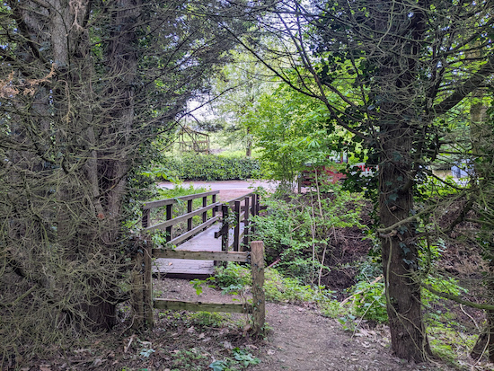 Cross the footbridge then turn left