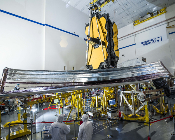 Technicians watch as NASA's James Webb Space Telescope unfurls its sunshield during a final pre-launch test at the Northrop Grumman facility in Redondo Beach, California.