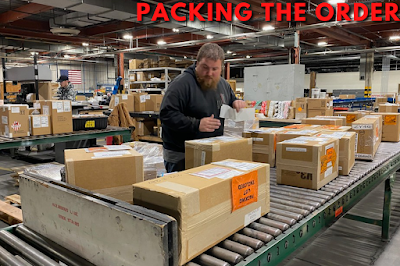 Packer packing the order at the packing station