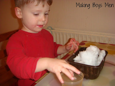 kids playing with water beads and snow