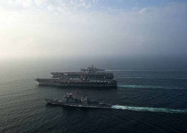 USS Enterprise (CVN 65), the Nimitz-class aircraft carrier USS Dwight D. Eisenhower (CVN 69) and the Ticonderoga-class guided-missile cruisers USS Vicksburg (CG 69) and USS Hue City (CG 66) 