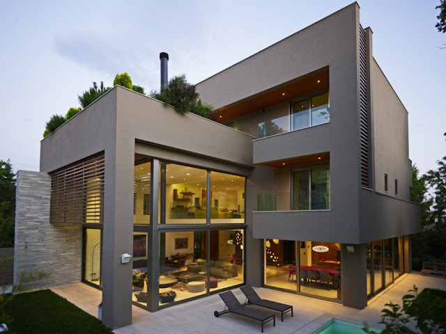 Modern home with concrete and glass facade 