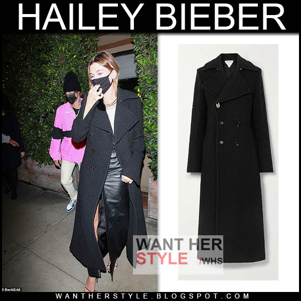 Hailey Bieber in long black coat