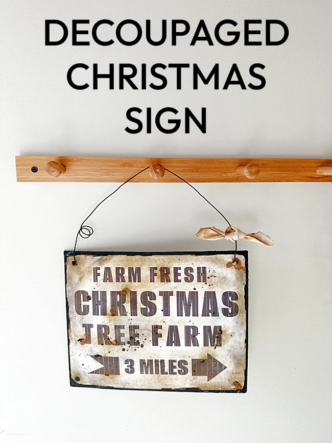 decoupaged Christmas sign on peg hook