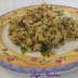 Turnip green rice topped with cashews and cheese