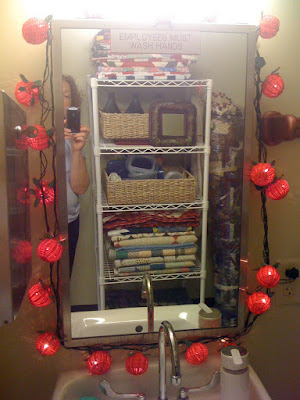 And finally I hung my string of wicker tomato lights around the bathroom 