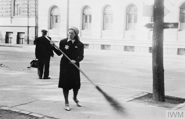 Sweeping streets in Riga, 22 August 1941 worldwartwo.filminspector.com