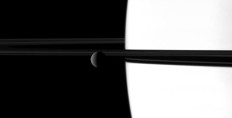 Rhea, Saturn and its rings.