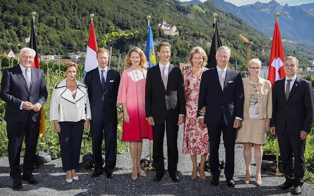 Queen Mathilde wore a printed silk midi dress by Etro. Grand Duchess Maria Teresa and Hereditary Princess Sophie