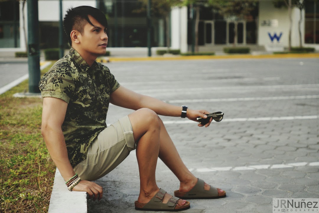 Bibo Bayona wearing camouflage shirt