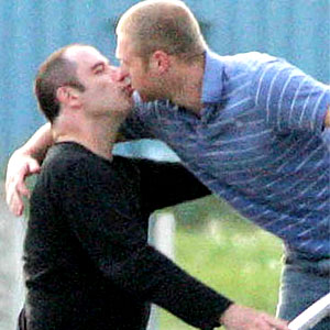 John Travolta kissing a man