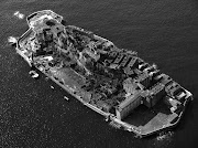 This is Gunkanjima, Japan, also known as “Battleship Island. (hashima island )