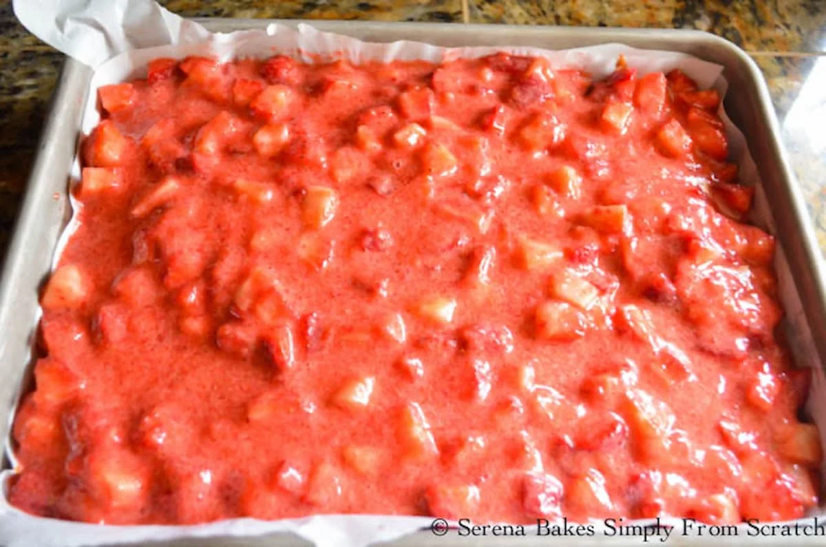 Strawberry mixture spread across top of yellow cake.