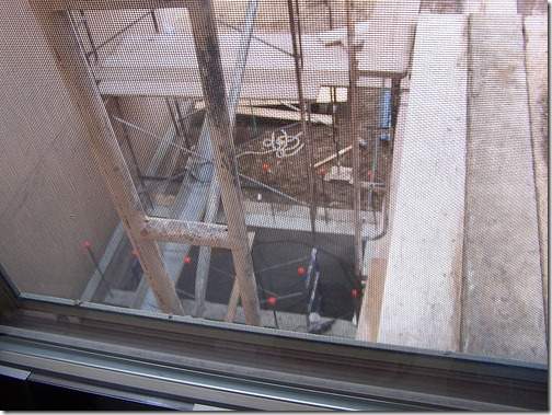 Scaffolding is outside my window again, this time to set forms for the elevator shaft