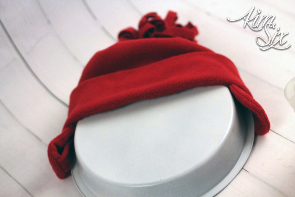 Adding hat to pie pan snowman