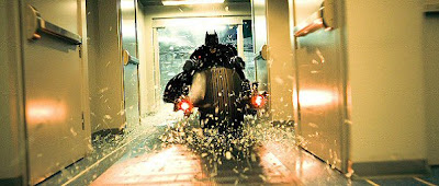 Batman breaking through store windows on his bat motorcycle in an attempt to stop The Joker.