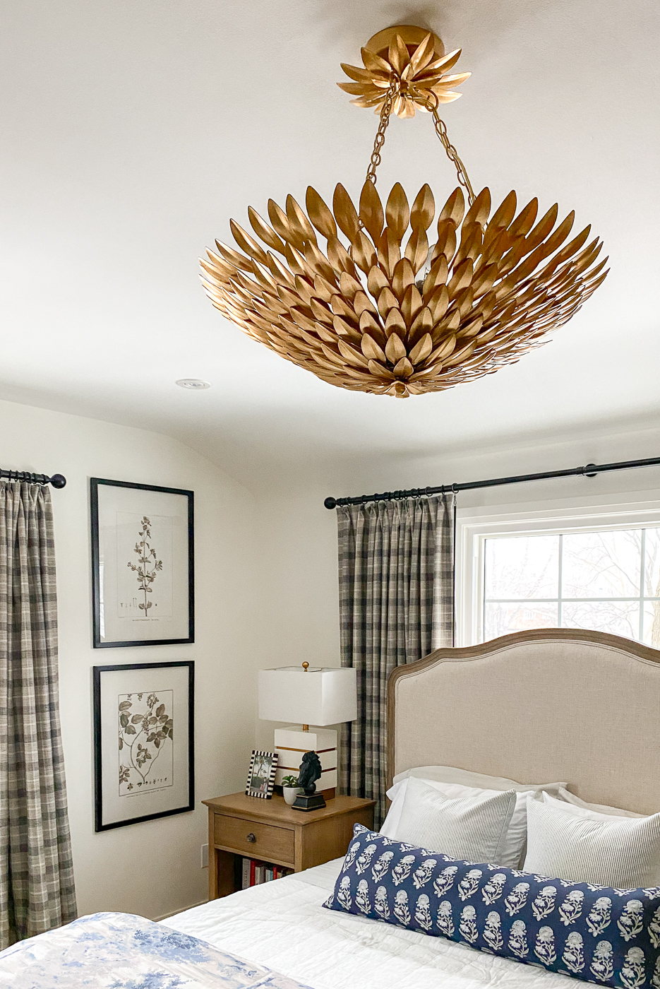 brass gold chandelier in master bedroom, blue and grey bedroom design