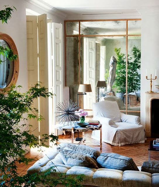 eclectic white living room gold accents oversized mirror mirrored wall