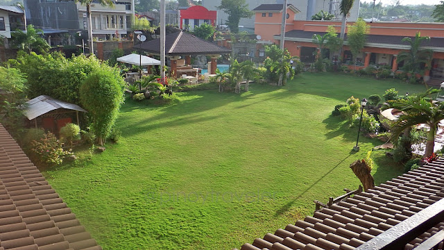 morning view of the garden and swimming pool at Ormoc Villa Hotel